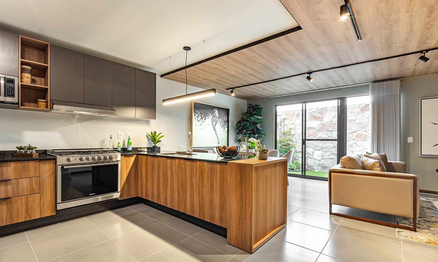 Cocina, sala y comedor de la casa Modelo 115